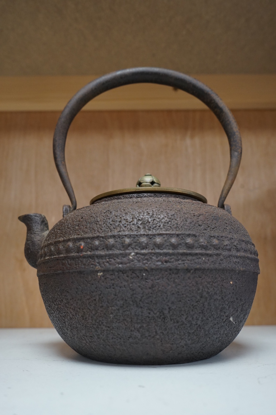 A Japanese cast-iron teapot, 22.5cm high
